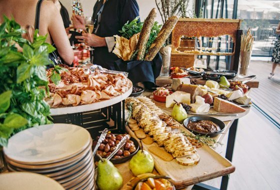 Assorted dishes laid out across a table for a catered spread