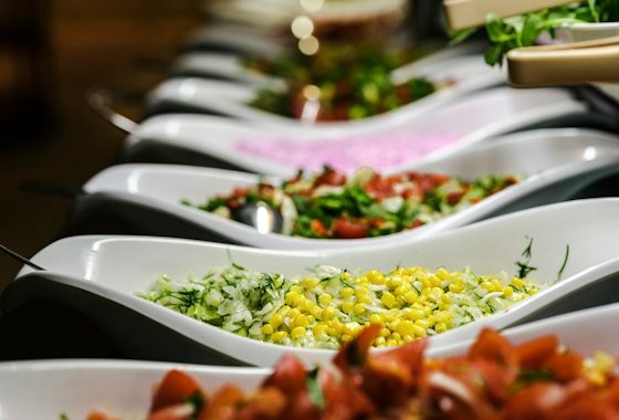 Long table filled with plated dishes ready for guests